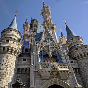 A close-up of the front of Cinderella Castle with clear skies.