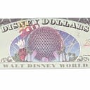 A Disney Dollar bill featuring the Epcot year 2000 celebration at Walt Disney World.